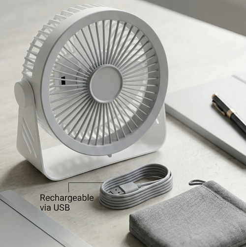 White rechargeable desk fan with USB cable on a light surface